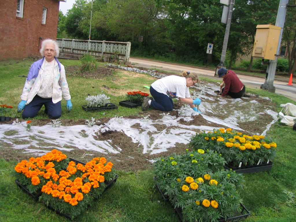 Everyone is welcome to help plant and weed our community flower gardens!